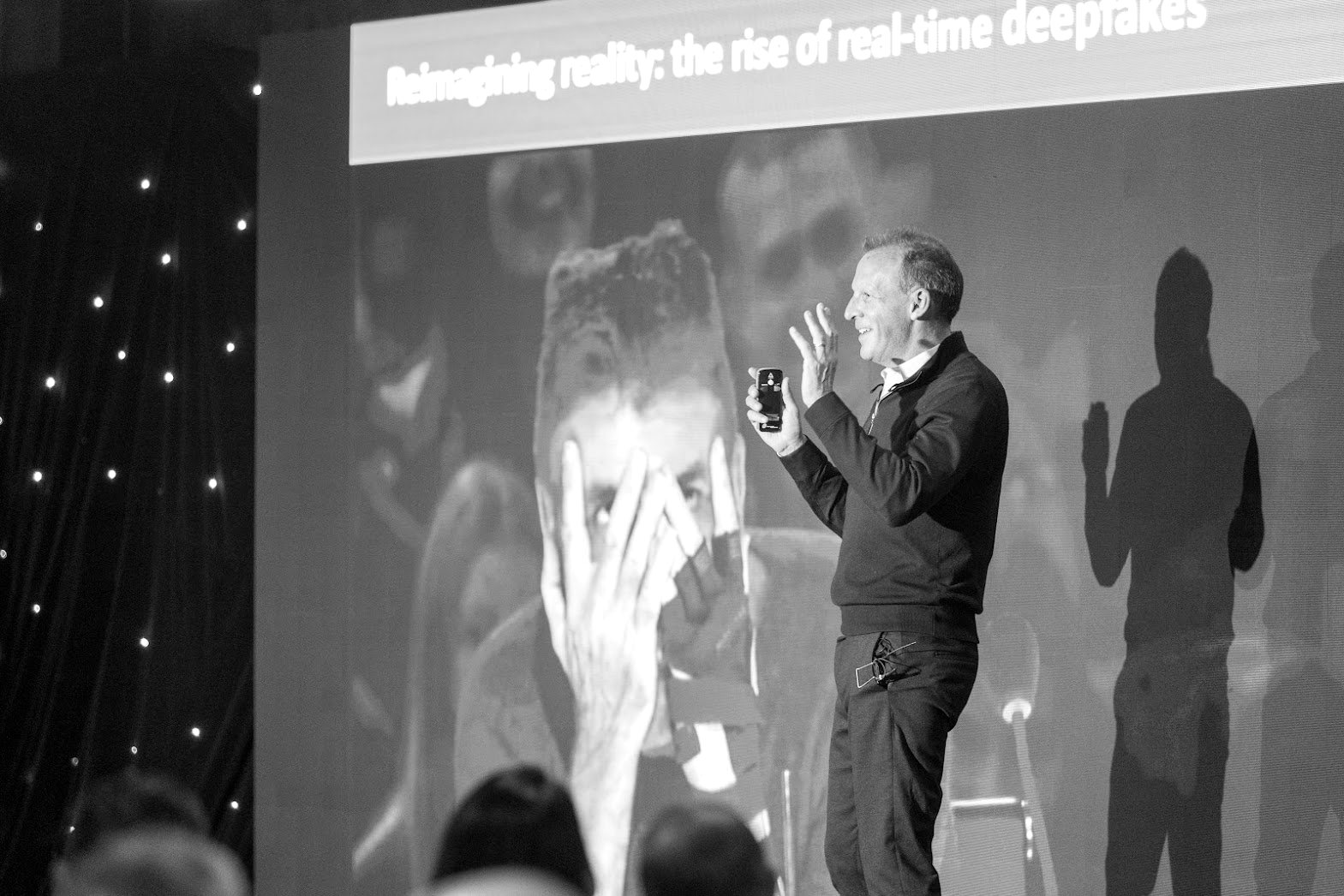 Simon Greenman presenting on real-time deepfakes